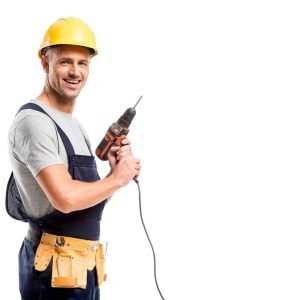 smiling-construction-worker-in-helmet-holding-drill-isolated-on-white-e1678554185137.jpg